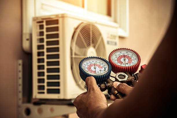 Professional Air Conditioning Service technician working in Big Sandy, TN